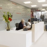 white corian reception desk with limestone